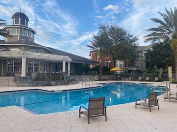 Resort-inspired pool with lap lane and heated jacuzzi